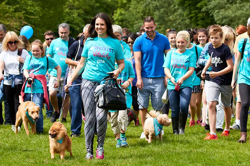 A group of fundraiser on a charity dog walk.